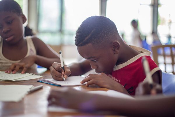 Boy writing on paper